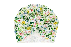Close-up of baby turban hat featuring a donut knot and colorful watercolor floral prints