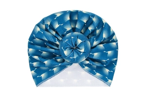 Detail of dark blue baby turban hat with white crane print and donut knot design