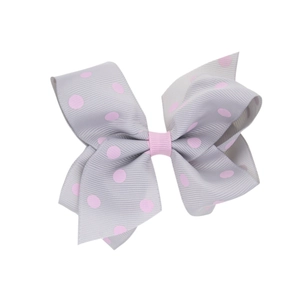 Détail d'un nœud à cheveux gris en gros-grain avec pois roses et ruban central rose