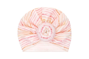 Detail of pink and orange watercolor striped baby turban hat with donut knot decoration