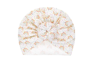 Detail view of baby turban hat featuring rainbow print and soft donut knot decoration