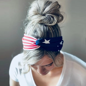 Detail view of American flag twist headband featuring patriotic red stripes and white stars