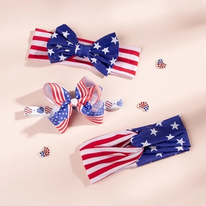 Detailed view of patriotic 4th of July baby headbands with stars and stripes bow patterns