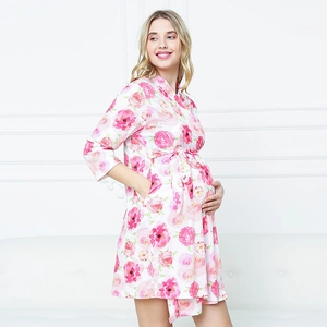 Close-up of floral print maternity robe with pink roses and belted waist detail
