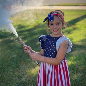 Close-up of girl wearing patriotic stars and stripes dress with matching bow headband