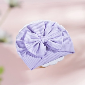 Close-up of light purple baby turban hat with a large layered decorative bow