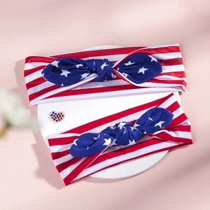 Detail of USA Flag striped knot headbands with rhinestone heart badge for parent and child