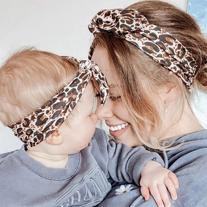 Detail of leopard print knot headband set on mother and baby for family matching