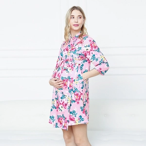 Detail view of pink floral maternity robe with soft cotton texture and kimono waist tie