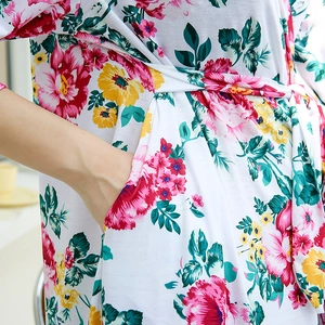 Close-up of floral print maternity robe with side pocket and soft fabric detail