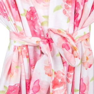 Close-up of pink floral print maternity robe featuring a matching belted waist tie design