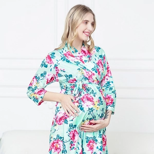 Detail of mint green maternity floral robe with pink peonies for prenatal and postpartum wear