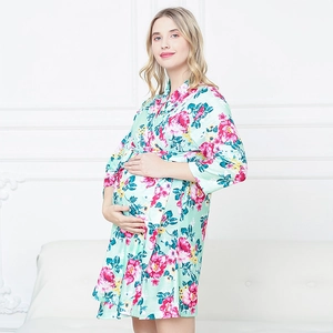 Close-up of floral maternity robe with pink flowers, tie waist and silky smooth fabric