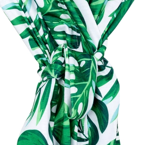 Detail of maternity robe showing green tropical palm leaf print and adjustable waist tie