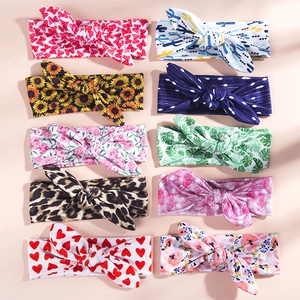 Ten styles of baby bunny ear headbands with leopard and floral prints in a neat array