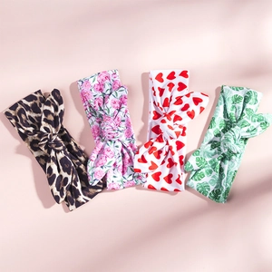 Detailed set of four printed rabbit ear headbands featuring leopard and floral patterns