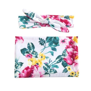 Floral print baby swaddle blanket and headband set with red and yellow flowers