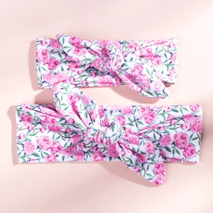 Close-up of pink floral knot headbands set for mother and baby in soft stretch cotton