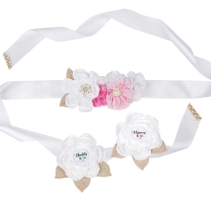 Detail of Mommy To Be sash with pink lace flowers and matching Daddy To Be badges