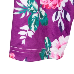 Close-up of floral maternity robe showing purple fabric, pink flowers and double-needle stitching