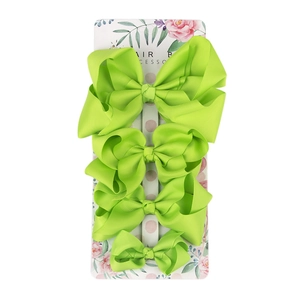 Set of four neon green grosgrain ribbon hair bows in varied sizes on a floral card