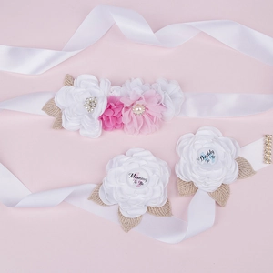 Pink chiffon flower belly band and badges with Mommy and Daddy To Be text for baby shower