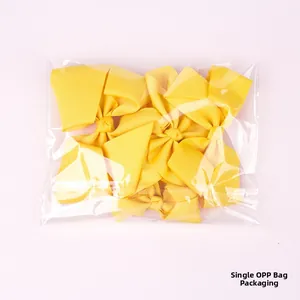 Yellow grosgrain ribbon hair bows for girls in a clear single OPP bag packaging