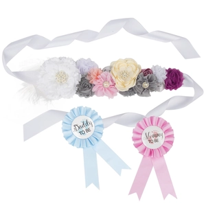 Baby shower set with floral Mom To Be sash and matching Daddy To Be pins in blue and pink