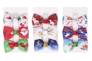 Detail view of 9-piece Christmas bow hair clips set with Santa and reindeer prints