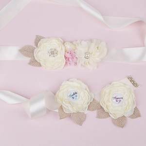 Detailed set of Daddy to Be and Mommy to Be badges with cream satin sash for baby shower