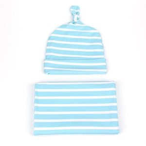 Detail of baby swaddle blanket and knotted hat set with light blue and white stripes