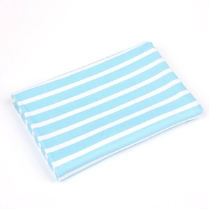 Close-up of soft blue and white striped fabric texture and neat folded edges
