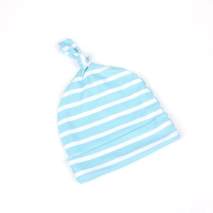 Close-up of soft blue and white striped knit baby hat with a decorative top knot
