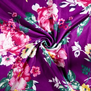 Detail of soft purple floral fabric with pink hibiscus patterns for maternity robes