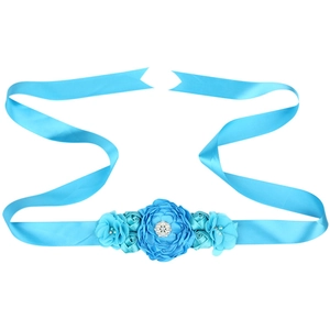 Close-up of sky blue maternity sash with handmade chiffon flowers and pearl accents