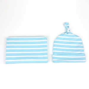 Sky blue striped baby swaddle blanket and matching knotted hat set in soft cotton