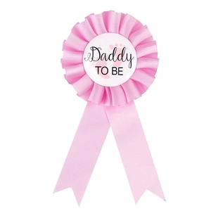 Pink satin Mommy to Be corsage badge for baby shower events with delicate ribbon detail