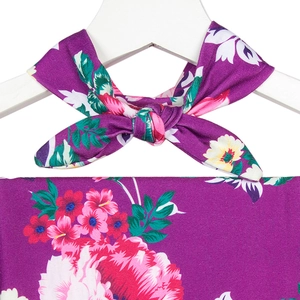 Detail of floral maternity robe showing the soft fabric texture and bow tie design