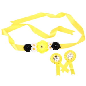 Detail of bee theme baby shower sash set with Mommy and Daddy to be flower badges