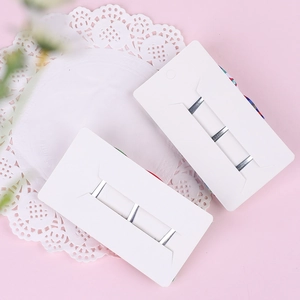 Set of six silver metal hair clips for kids on minimalist display cards with pink background