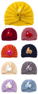 Detail showing high-elastic knitted turban baby hats with cute rabbit bunny decorations