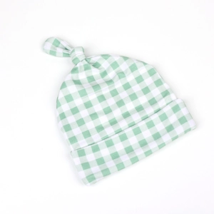 Baby knotted beanie hat with classic green and white plaid pattern in soft cotton