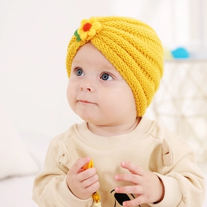 Cute yellow knitted baby beanie hat with 3D floral decoration for autumn and winter warmth