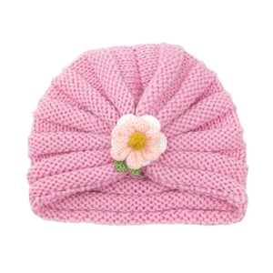Pink knitted baby hat with handmade 3D floral decoration for autumn and winter warmth