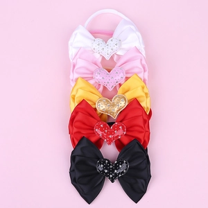 Detailed set of five satin bow headbands with crystal heart accents in five colors