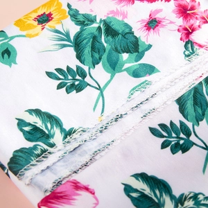 Detailed view of floral print fabric with high-quality stitching for maternity robe sets