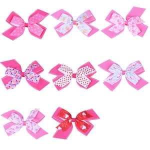 Detailed set of eight pink and red heart-themed ribbon bows with white stitching
