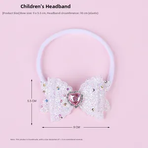 Detail of baby nylon headband with white sequin bow and pink heart crystal centerpiece