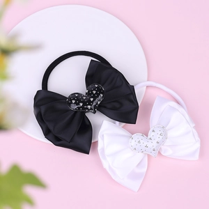 Two-pack nylon baby headbands with triple-layered satin bows and crystal heart accents