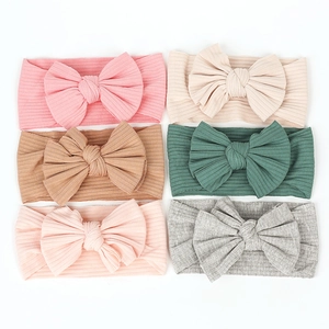 Detail view of cotton ribbed baby headbands featuring six soft colors and DIY bow design